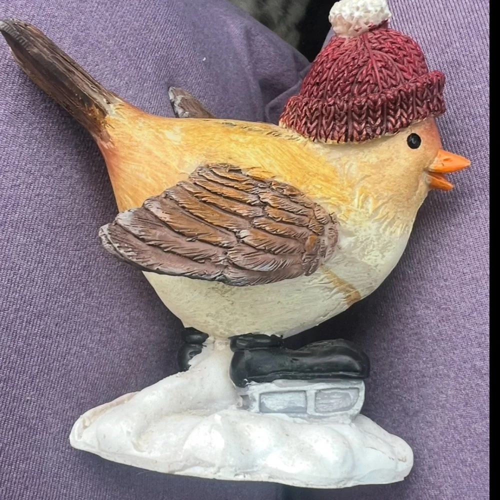 Adorable Small Bird figurine With Winter Hat And Ice Skates. In good condition.